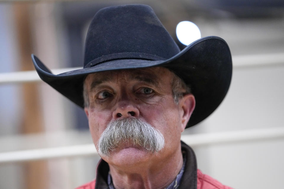 Bill Martin, manager of the Lone Star Stockyards, speaks to The Associated Press about the regional impact of the Smokehouse Creek Fire on local ranchers, Friday, March 1, 2024, in Wildorado, Texas. The wildfire, which started Monday, has left behind a charred landscape of scorched prairie, dead cattle and burned-out homes in the Texas Panhandle. (AP Photo/Julio Cortez)