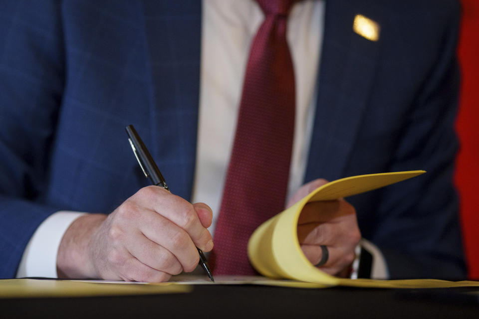 Gov. Spencer Cox signs two social media regulation bills during a ceremony at the Capitol building in Salt Lake City on Thursday, March 23, 2023. Cox signed a pair of measures that aim to limit when and where children can use social media and stop companies from luring kids to the sites. (Trent Nelson/The Salt Lake Tribune via AP)