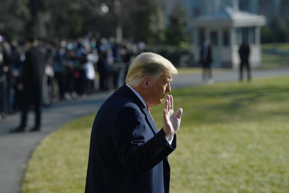 TOPSHOT - US President Donald Trump waves to the media outside the White House on January 12, 2021 in Washington,DC before his departure to Alamo, Texas. (Photo by Brendan Smialowski / AFP) (Photo by BRENDAN SMIALOWSKI/AFP via Getty Images)