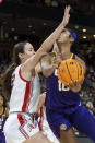 Utah's Jenna Johnson (22) puts her arm against the face of LSU's Angel Reese (10) during the first half of a Sweet 16 college basketball game in the women's NCAA Tournament in Greenville, S.C., Friday, March 24, 2023. (AP Photo/Mic Smith)