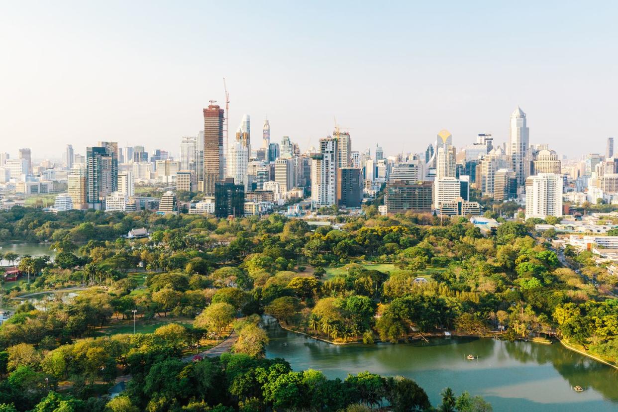 bangkok cityscape with lumpini park and modern skyscrapers, aerial view