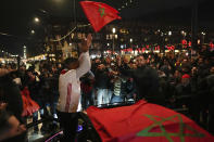 FILE - Morocco fans celebrate their team's victory against Spain in the World Cup round of 16 soccer match between Morocco and Spain, in Amsterdam, Netherlands, Tuesday, Dec. 6, 2022. (AP Photo/Peter Dejong, File)