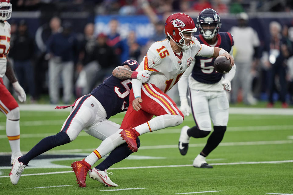 Kansas City Chiefs quarterback Patrick Mahomes (15) is sacked by Houston Texans linebacker Blake Cashman (53) during overtime in an NFL football game Sunday, Dec. 18, 2022, in Houston. (AP Photo/David J. Phillip)