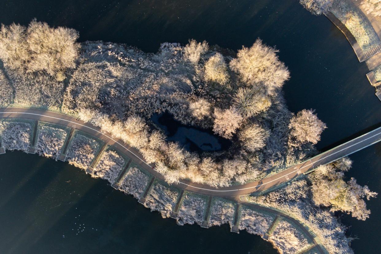 Frozen ground and vegetation by the river Avon in Warwick. The Met Office has issued a number of weather warnings for snow and ice for parts of Scotland, Northern Ireland, Wales and the east coast and south-west England over the coming days. Picture date: Thursday December 8, 2022.