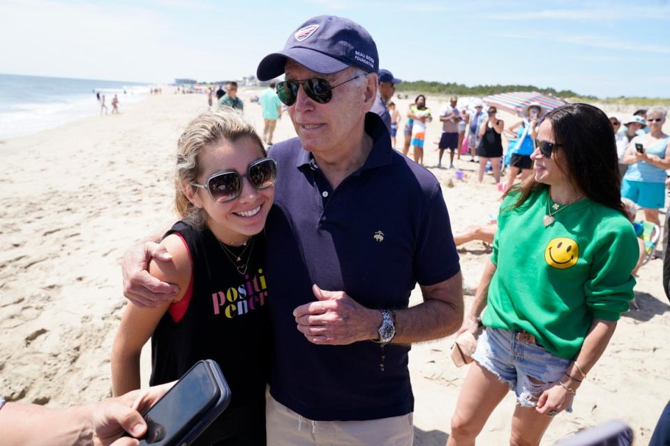 President Joe Biden talks to the media after walking on the beach with his granddaughter Natalie Biden, left, and his daughter Ashley Biden, right, Monday, June 20, 2022 at Rehoboth Beach, Del. (AP)