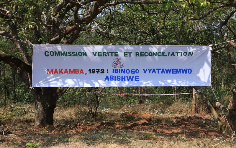 A banner hangs to identify the site of a 1972 mass grave in the Gikuzi village, Makamba Province