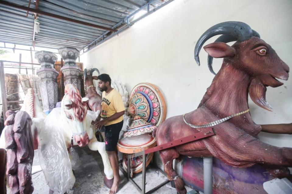 The Kavadi Masters member S. Kumaraguru working on a 'kavadi' to be used for this year's Thaipusam at their workshop in Taman Rishah, Ipoh. — Picture by Farhan Najib