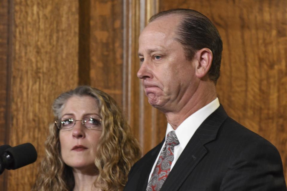 Jim Piazza, standing next to his wife Evelyn, pauses while speaking at a news conference in the Pennsylvania governor's reception room, Friday, Oct. 19, 2018 in Harrisburg, Pa., on anti-hazing legislation inspired by their son, Penn State student Tim Piazza who died after a night of drinking in a fraternity house. Gov. Tom Wolf signed the legislation moments later. (AP Photo/Marc Levy)