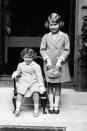 <p>Pictured here in 1933, a two-year-old Princess Margaret sits next to her big sister, then Princess Elizabeth, aged seven. [Photo: PA Images] </p>