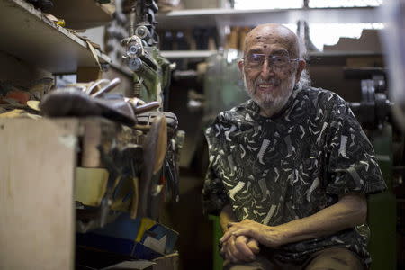 Owner Arturo Azinian poses for a portrait in his shoe repair shop in Beverly Hills, California April 24, 2015. REUTERS/Mario Anzouni