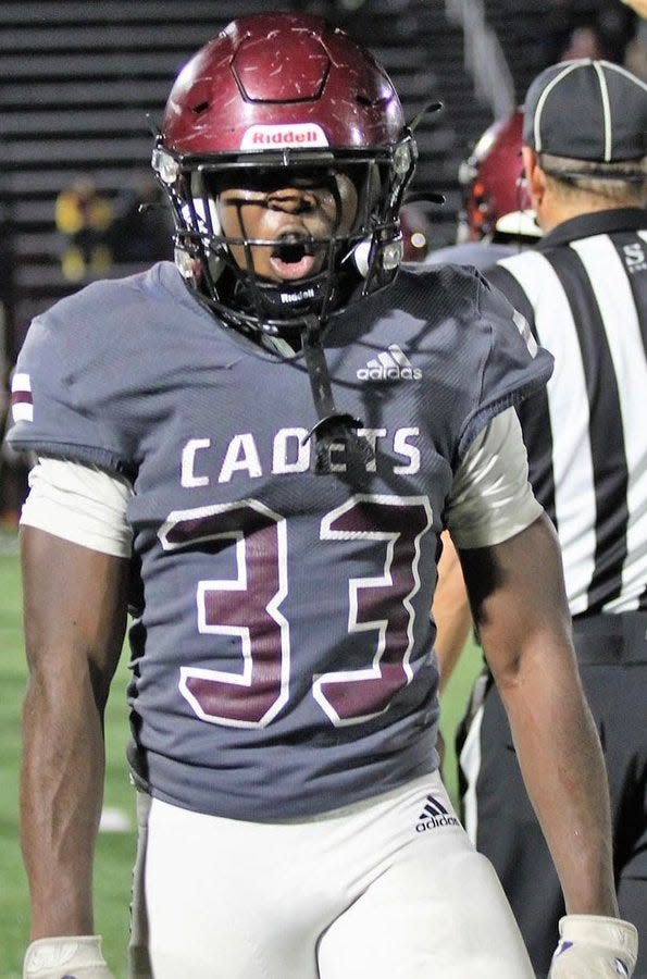 Benedictine's Bryce Baker celebrates a play in the Cadets' playoff win over Stockbridge Friday night.