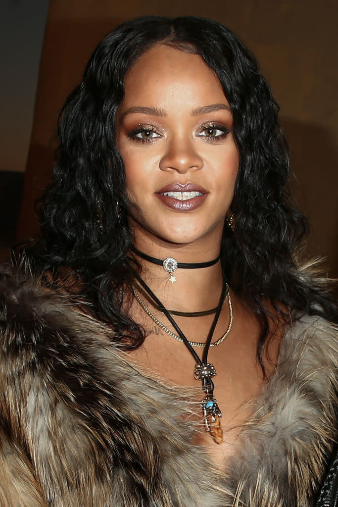 <p>Rihanna looked bronzed and beautiful sitting front row at the Dior Cruise show. The rich tones in her makeup accentuate her green eyes and full lips. (Photo: Rich Fury/Getty Images) </p>