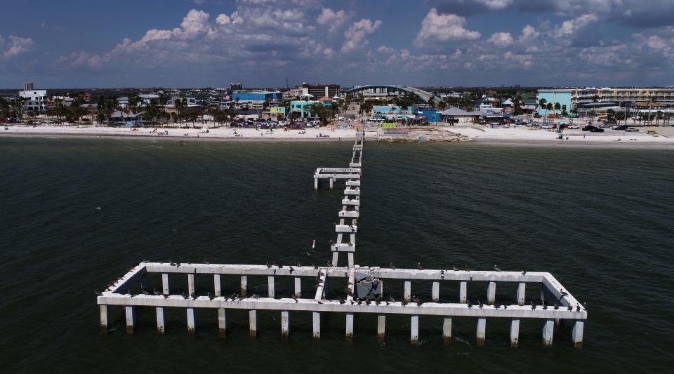 Almost a year after the impact of Hurricane Ian changed the lives of Fort Myers Beach residents, the town continues to work on its recovery. This aerial image of Fort Myers Beach was taken September 14, 2023. Ricardo Rolon/USA TODAY NETWORK-FLORIDA