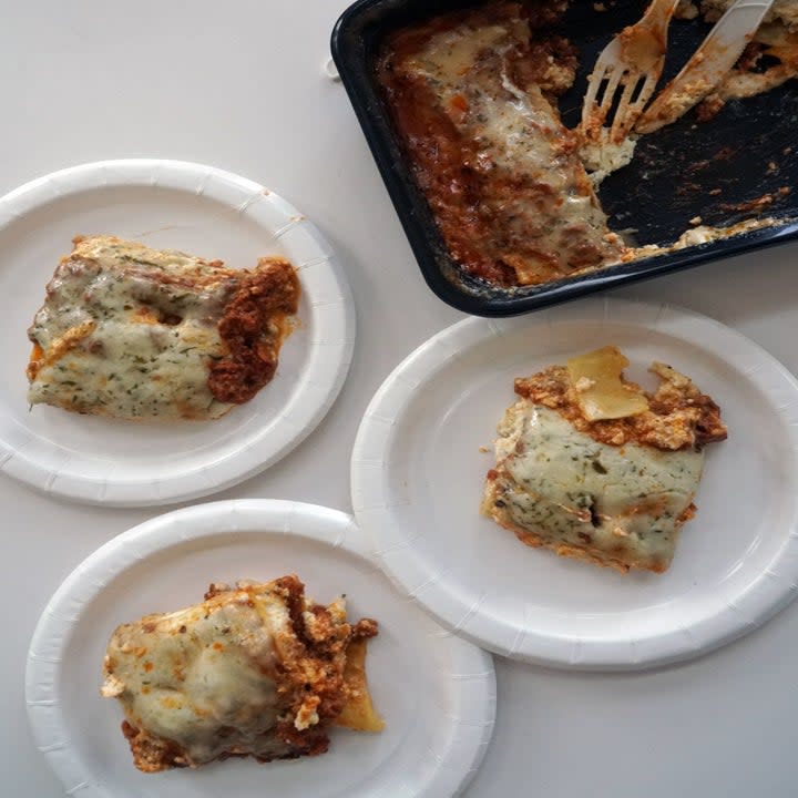 Three slices of lasagna on plates