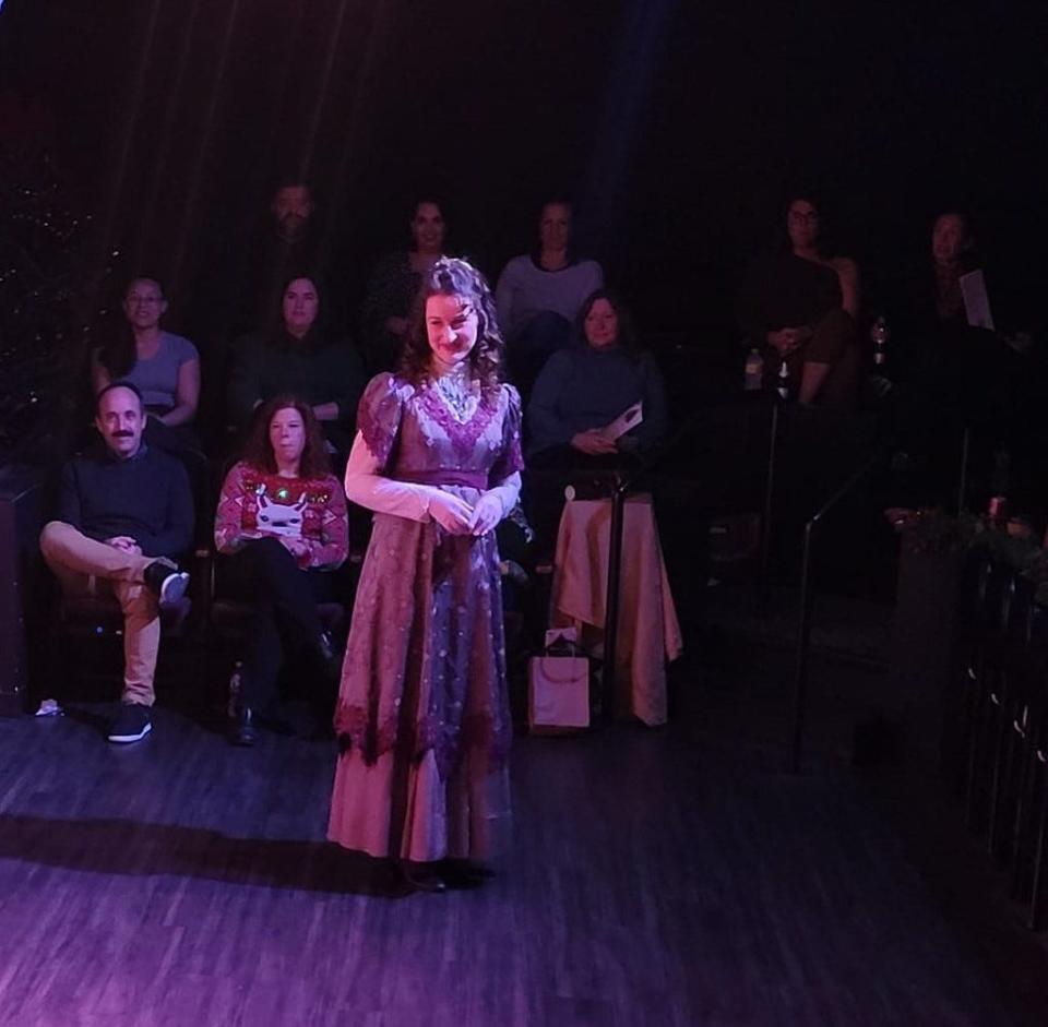 Portraying Jane Austen, Karis McMurry watches some of the iconic writer's beloved characters take the stage during opening night of Oklahoma Shakespeare in the Park's new production of "Jane Austen's Christmas Cracker" Dec. 9, 2022.