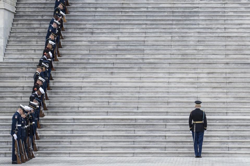 <p>Service members prepare for the departure of the casket of former U.S. President George H. W. Bush from the U.S. Capitol.</p>