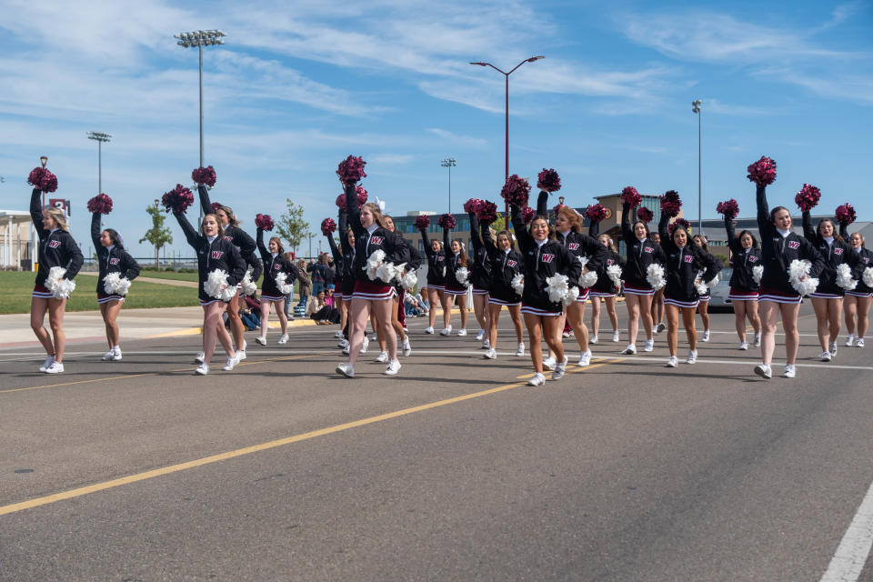 The WT Spirit Squad gets the crowd into it Saturday afternoon at the WT Homecoming Parade in Canyon.