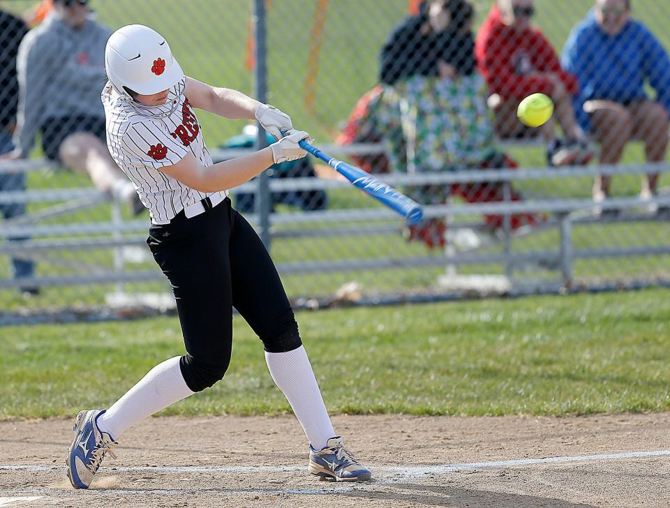 Crestview High School's Chesnie Patton (14) connects with a pitch against Western Reserve High School during high school softball action Tuesday, April 11, 2023. TOM E. PUSKAR/ASHLAND TIMES-GAZETTE