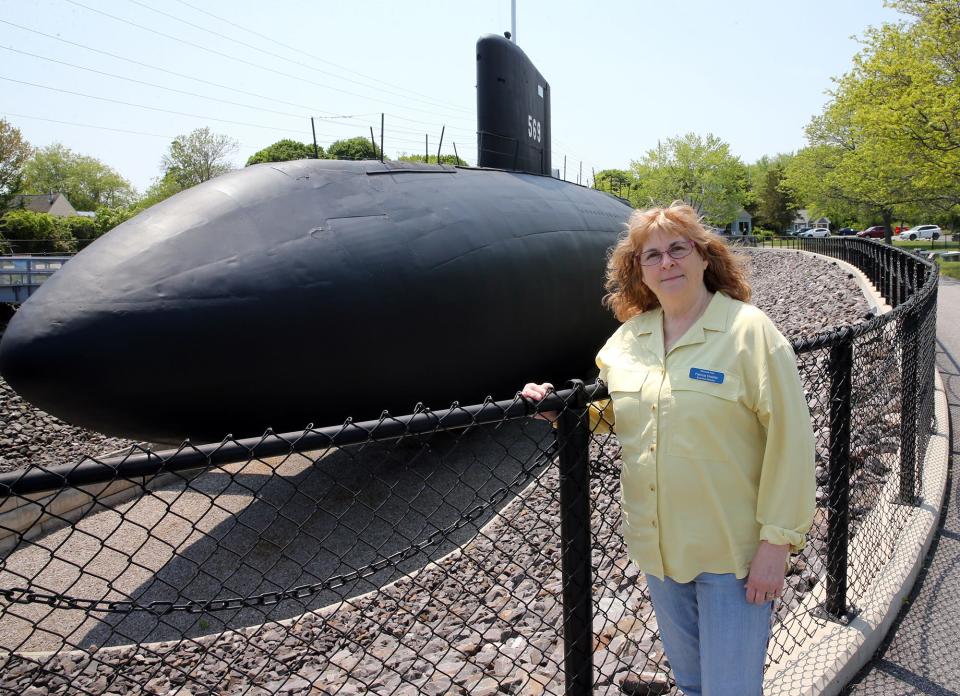 Patricia Violette-Adams, executive director of Albacore Park shows off the boat in Portsmouth May 22, 2023. Visitors can go inside the vessel.