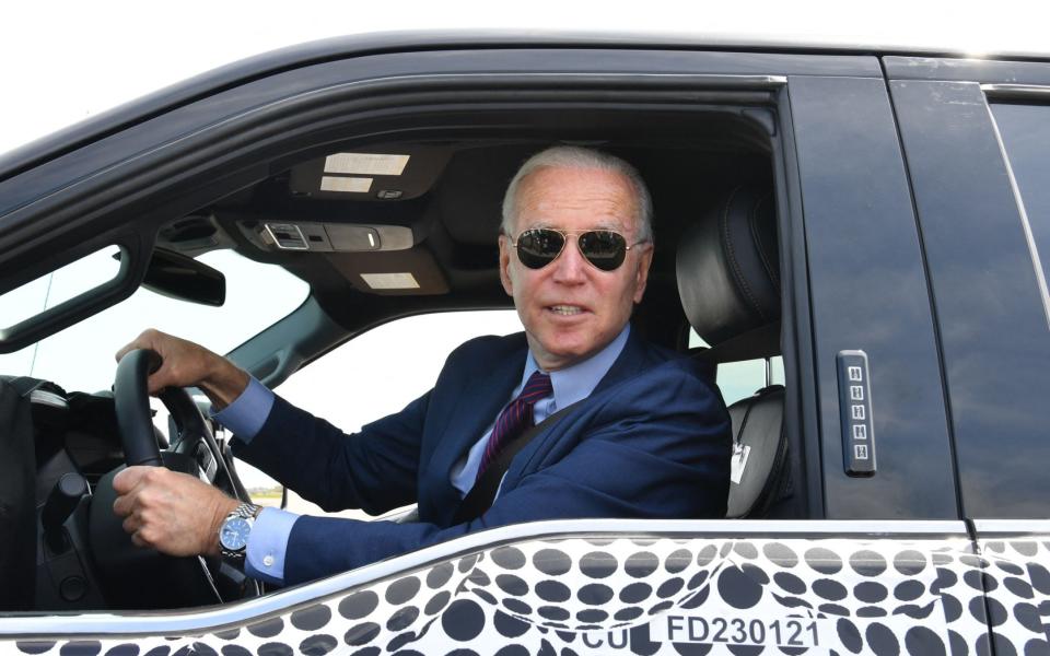 US President Joe Biden drives the new electric Ford F-150 Lightning - NICHOLAS KAMM/AFP via Getty Images