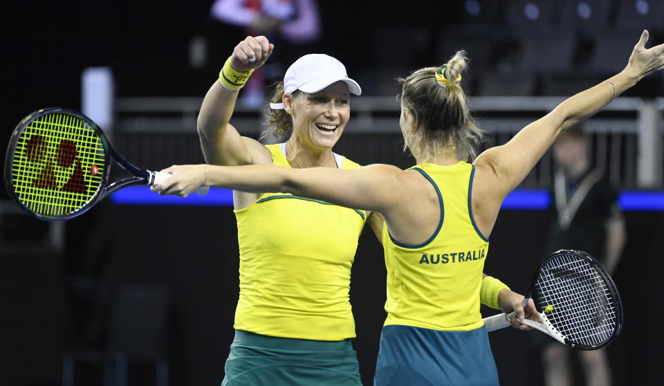 Sam Stosur (pictured left) and Storm Sanders (pictured right) celebrate.