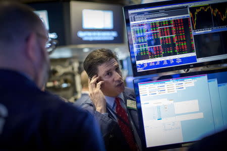 Traders work on the floor of the New York Stock Exchange April 30, 2015. REUTERS/Brendan McDermid