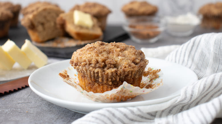 baked snickerdoodle muffin with crumble on plate