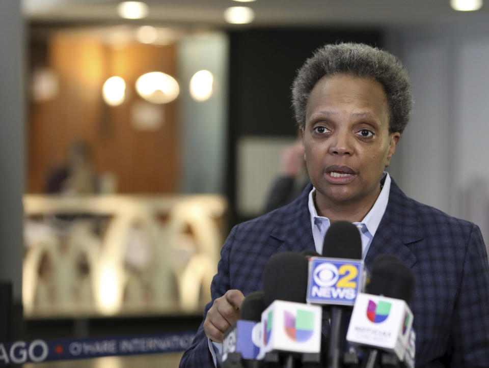 FILE - In this Sunday, March 15, 2020 file photo, Chicago Mayor Lori Lightfoot speaks to reporters at O'Hare International Airport in Chicago. The barbs that have flown between President Donald Trump and his family and Chicago Mayor Lori Lightfoot haven’t prevented either side from engaging occasionally in niceties. (AP Photo/Teresa Crawford, File)