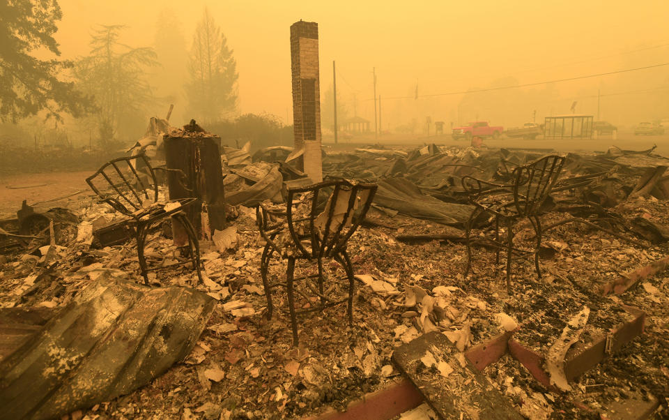 FILE - Chairs stand at the Gates Post office in the aftermath of a fire in Gates, Ore., Sept 9, 2020. The post office was destroyed along with several other buildings in the Santiam Canyon community as a result of the Santiam Fire. A jury verdict that found power company PacifiCorp liable for devastating wildfires in Oregon in 2020 is highlighting the legal and financial risks utilities face if they fail to take proper precautions for climate change. (Mark Ylen/Albany Democrat-Herald via AP, File)