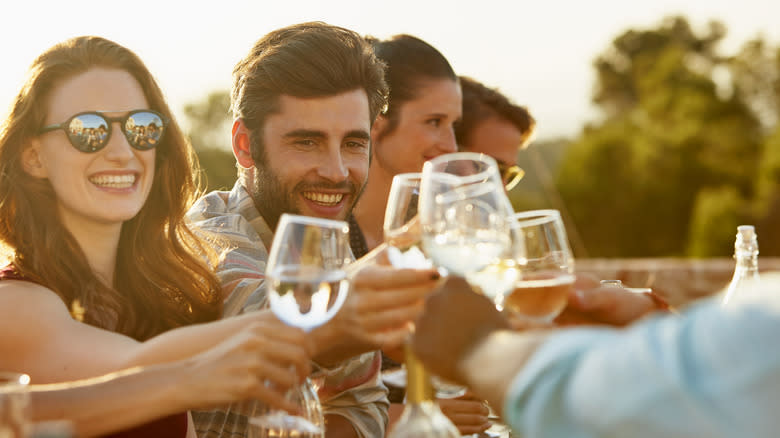 People toasting glasses of wine