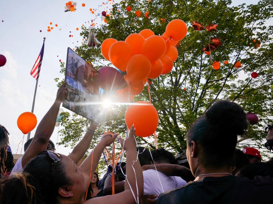 Community members release balloons during a vigil honoring Khalil Amari Allen, 18, in Southfield on Friday, July 14, 2023. Allen was shot and killed while driving to get food the evening of July 11.