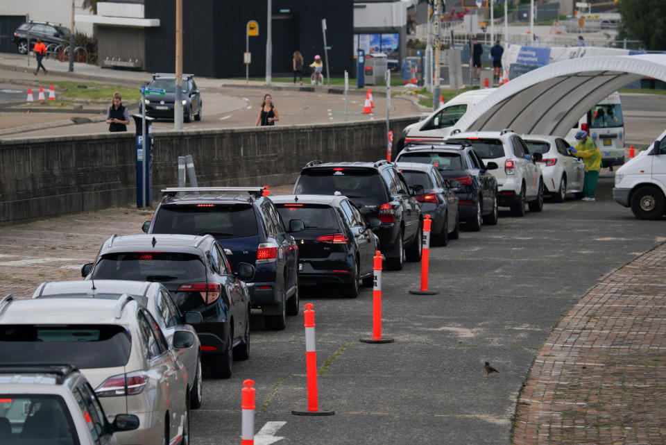 Vehicles line up at the Bondi Beach drive-through testing centre, where medical personnel are administering tests for the coronavirus disease. Source: AAP