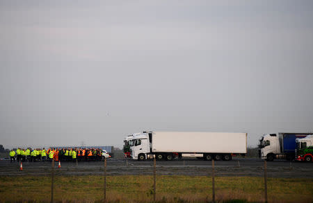 Briefing of lorries drivers and personnel is seen in front of the convoy of lorries before a test drive to the Port of Dover during a trial of how road will cope in case of a "no-deal" Brexit, Kent, Britain January 7, 2019. REUTERS/Toby Melville