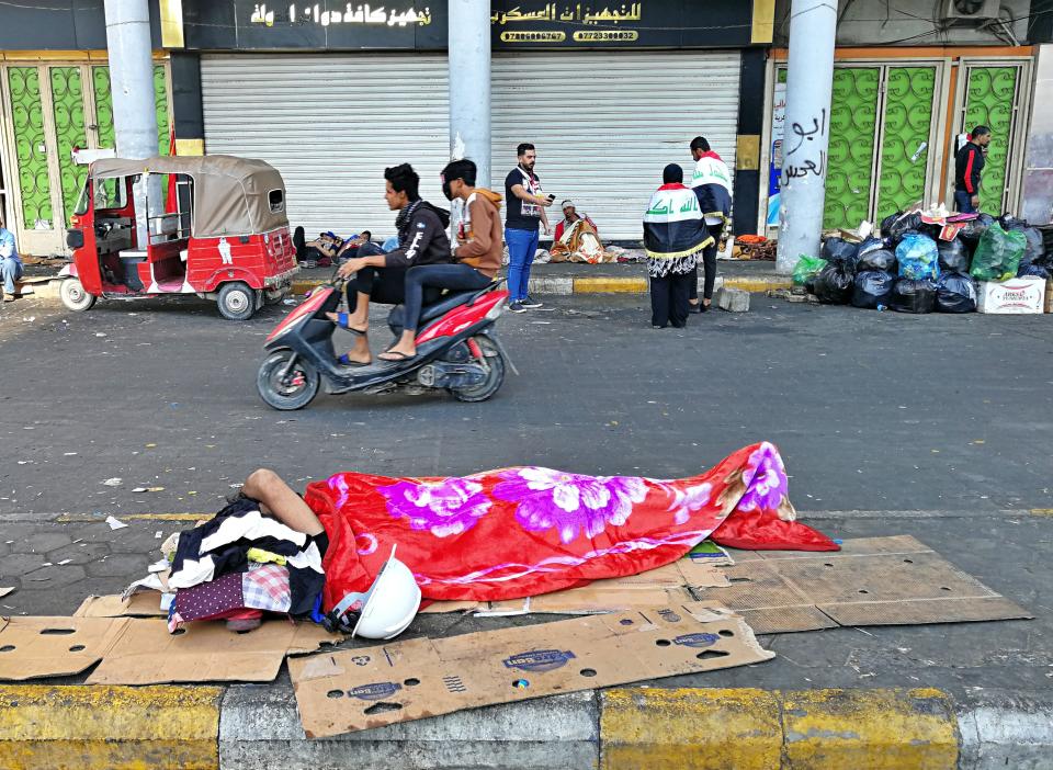 Anti-government protesters rest during a sit-in at Tahrir Square in Baghdad, Iraq, Friday, Nov. 1, 2019. (AP Photo/Khalid Mohammed)