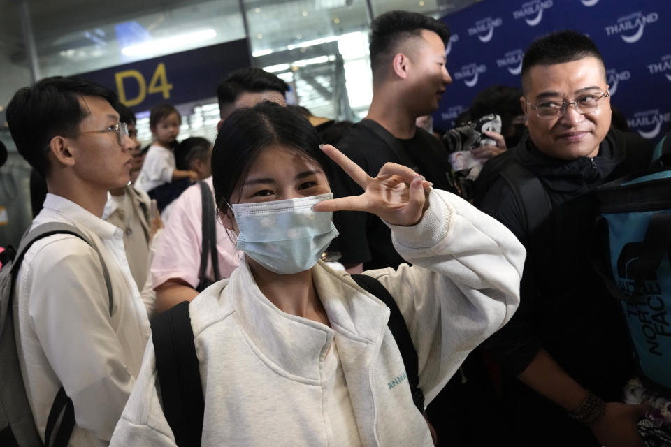 Chinese tourists reacts on the arrivals at Suvarnabhumi International Airport in Samut Prakarn province, Thailand, Monday, Sept. 25, 2023. Thailand, Monday, Sept. 25, 2023. Thailand's new government granting temporary visa-free entry to Chinese tourists, signaling that the recovery of the country's tourism industry is a top economic priority. (AP Photo/Sakchai Lalit)