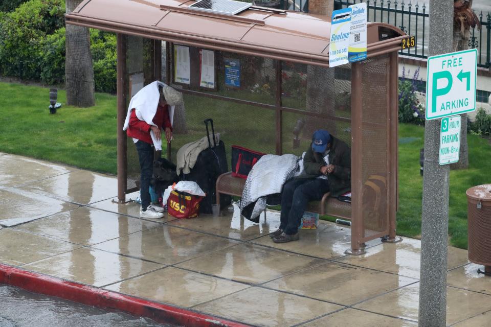 People get a break from the rain Monday in Palm Springs.