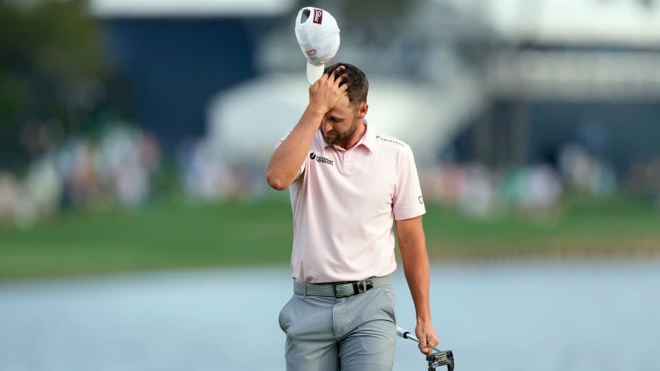 Clark reacts to his agonizing missed putt. - Lynne Sladky/AP