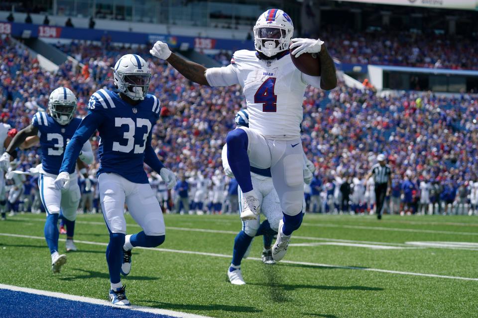 Buffalo Bills running back James Cook scores against the Indianapolis Colts during the first half of an NFL preseason football game in Orchard Park.