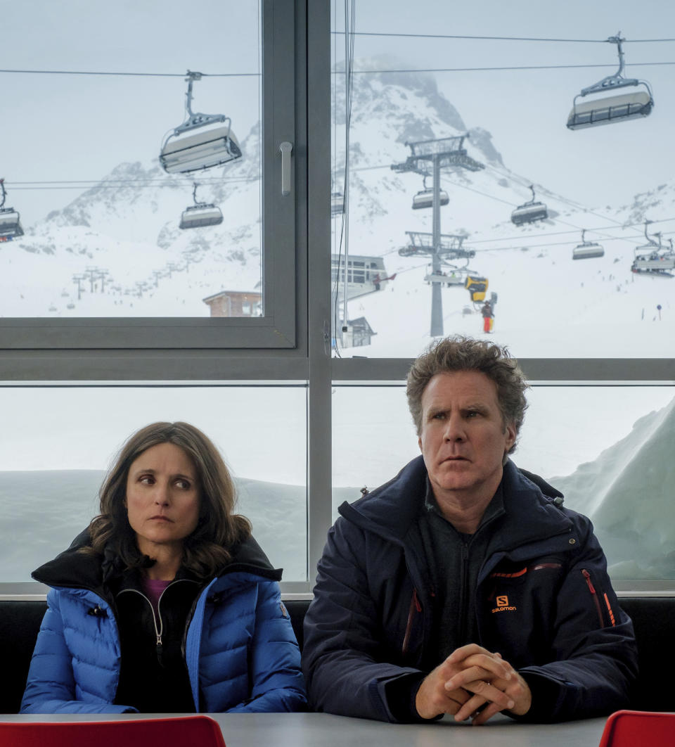 This image released by Fox Searchlight shows Julia Louis-Dreyfus, left, and Will Ferrell in a scene from "Downhill," a remake of the Swedish film "Force Majeure." (Jaap Buitendijk/Fox Searchlight via AP)