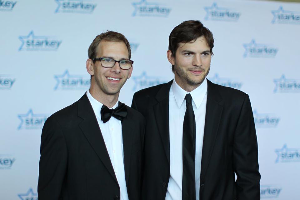 Kutcher, 44, pictured with his twin brother Michael in 2013 (Getty)