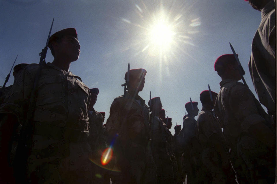 <p>New members of Force 17, Yasser Arafat’s personal security force, march with weapons during their graduation ceremony in the West Bank town of Dahariya, June 3, 2000. (Photo: Jacqueline Larma/AP) </p>