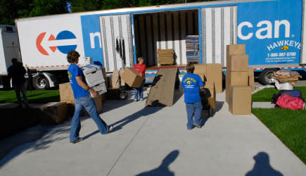 ADBNFR Family loads personal belongings on a truck