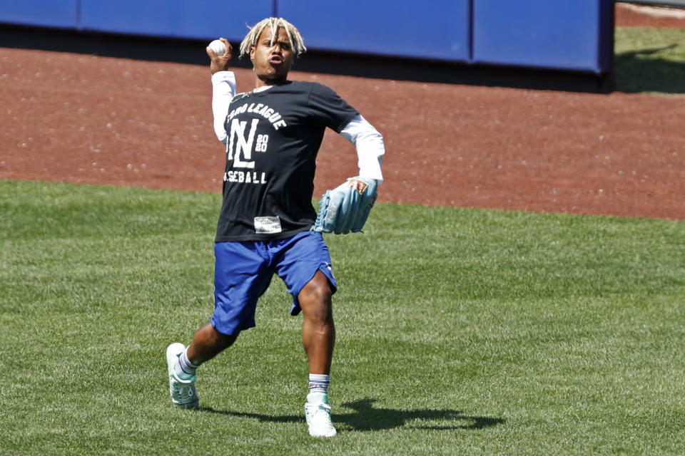 New York Mets starting pitcher Marcus Stroman throws in the outfield during baseball practice at Citi Field, Thursday, July 16, 2020, in New York. (AP Photo/Kathy Willens)