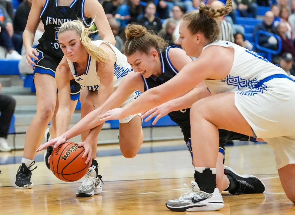 Jennings County Panthers Juliann Woodard (00) reaches for the ball against Franklin Community Grizzly Cubs guard Emma Sappenfield (20) on Thursday, Jan. 25, 2024, during the game at Franklin Community High School in Indianapolis. The Jennings County Panthers defeated the Franklin Community Grizzly Cubs, 51-44.