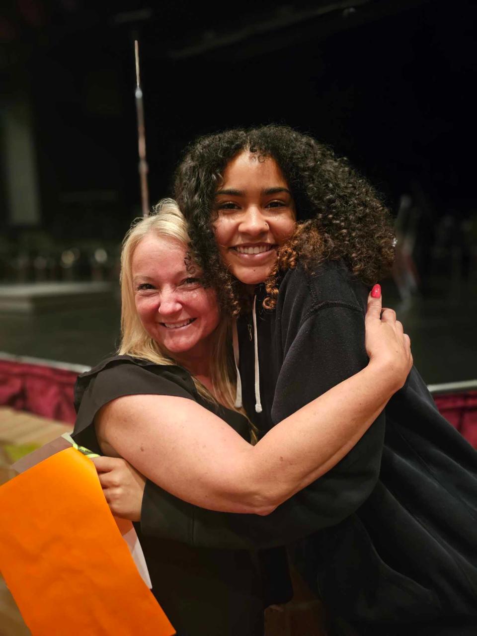 Gorrell Elementary School third grade teacher Geri Seifert gives former student Tatiana Moore a hug. Moore will graduate on Tuesday with the Washington High School Class of 2024.