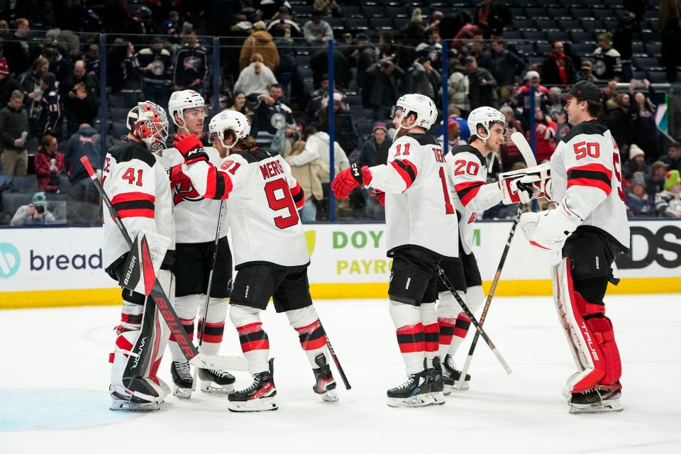 Jan 19, 2024; Columbus, Ohio, USA; Teammates congratulate New Jersey Devils goaltender Vitek Vanecek (41) on the 4-1 win over the Columbus Blue Jackets following the NHL hockey game at Nationwide Arena.