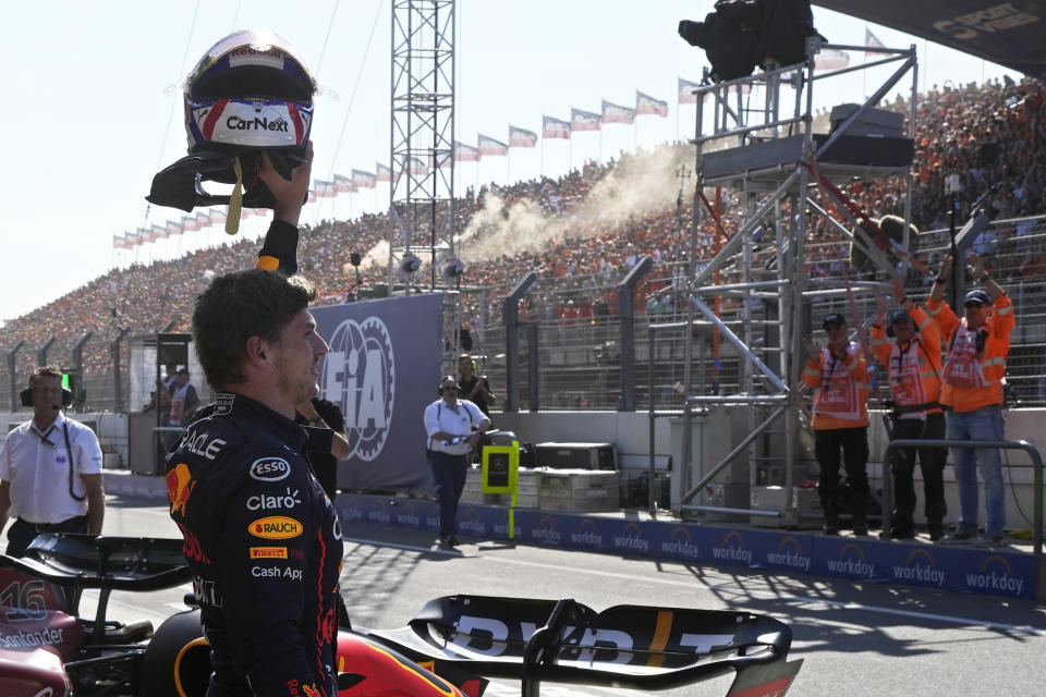 Red Bull driver Max Verstappen of the Netherlands celebrates after clocking the fastest time in the qualifying session ahead of Sunday's Formula One Dutch Grand Prix auto race, at the Zandvoort racetrack, in Zandvoort, Netherlands, Saturday, Sept. 3, 2022. (AP Photo/Peter Dejong)