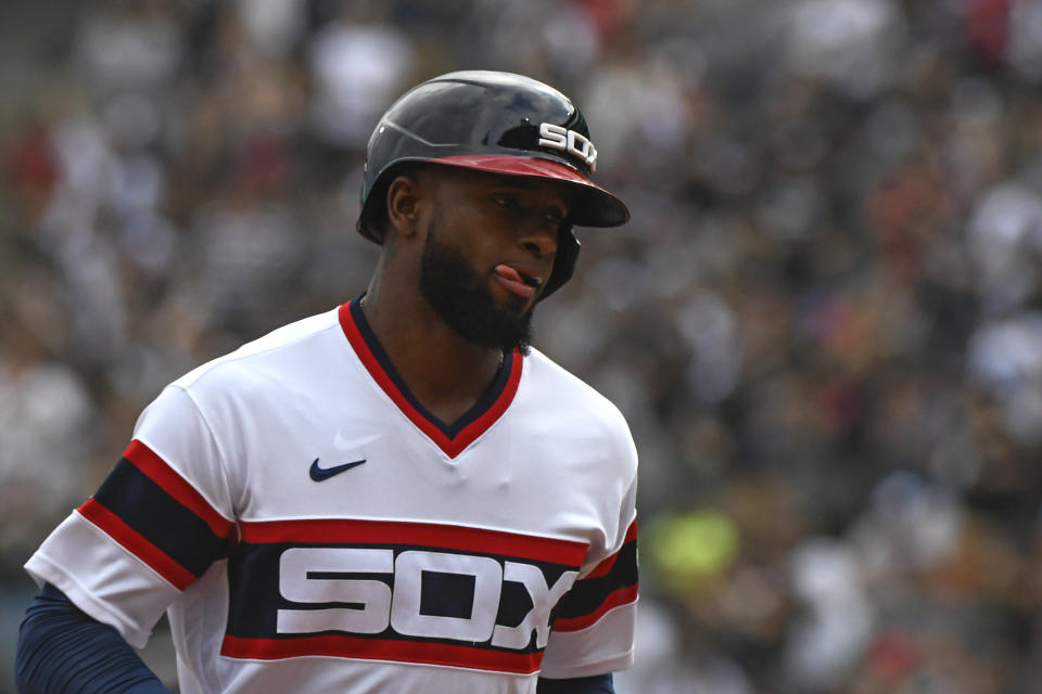 Chicago White Sox's Luis Robert reacts after hitting a home run during the first inning of a baseball game against the Detroit Tigers, Sunday, Oct. 3, 2021, in Chicago. (AP Photo/Matt Marton)