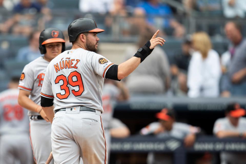 Baltimore Orioles' Renato Nunez reacts after scoring on a one run double by Jonathan Villar during the seventh inning of a baseball game against the New York Yankees, Wednesday, Aug. 14, 2019, in New York. (AP Photo/Mary Altaffer)