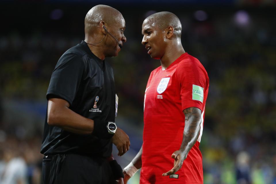 <p>Ashley Young speaks with the assistant referee after some physical contact between Harry Maguire and Juan Cuadrado </p>